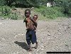 child carrying child, near Lake Baringo